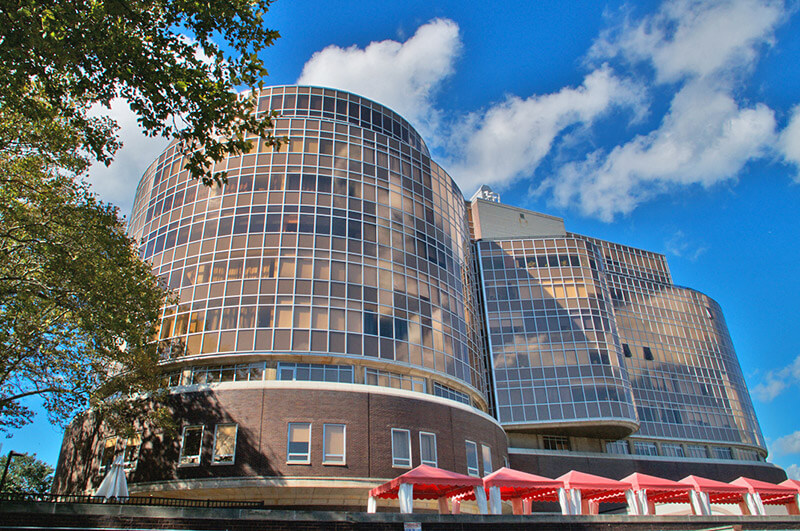 A photo of the exterior of the Metroclub condominium building.