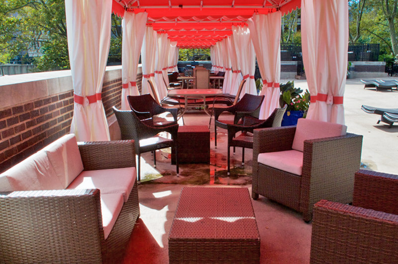 A photo of the Metroclub condominium building's poolside cabanas.